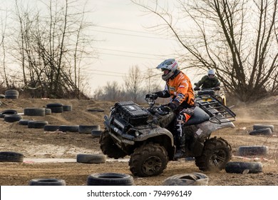 Biskupice Radlowskie, Poland - January 14, 2018: All-terrain Vehicle Driver Drifts And Stunts On A Sand Rough Terrain, Turns On A Two Wheels In A Moment Before Accident.