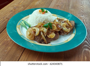 Bistec De Palomilla -  Cuban Dish Consisting Of Beef Round Steak Marinated In Garlic, Lime Juice, Salt And Pepper Then Pan-fried