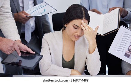 A bit too much to handle. Shot of a young businesswoman looking stressed out in a demanding office environment. - Powered by Shutterstock