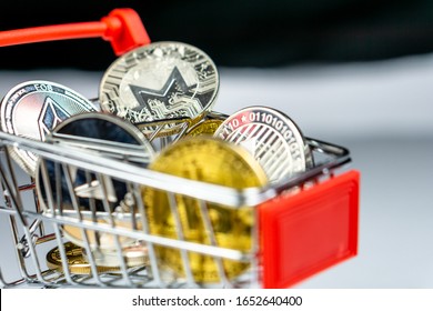 Bitcoin and altcoins coin in a shopping cart on a white background