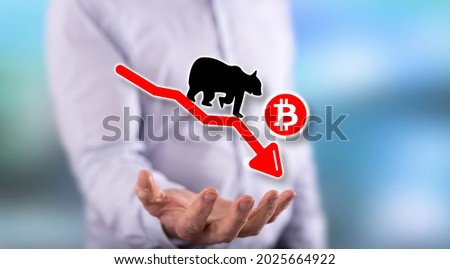 Bitcoin bearish trend concept above the hand of a man in background