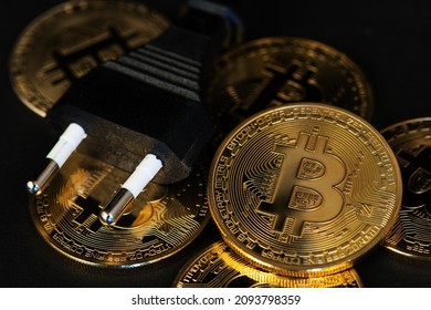Bitcoin BTC Cryptocurrency Coins. Bitcoin Crypto Currency Mining Energy Consumption Concept. BTC to USD Electric Power Plug In Bitcoin Mining Energy