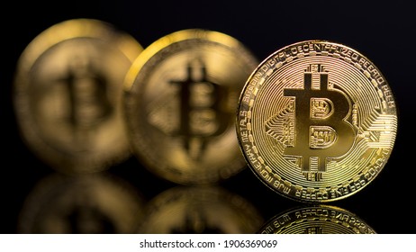 Bitcoin BTC Cryptocurrency Coins. Stock Market Concept. BTC to USD Real crypto metal golden coin. 