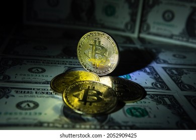 Bitcoin BTC virtual money and US Dollar banknotes. Background with Bitcoin cryptocurrency coins and US Dollar. Bitcoin cryptocurrency concept. USD to BTC
