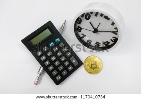 Bitcoin, clock and calculator. Cryptocurrency time tax return concept. copy space.
