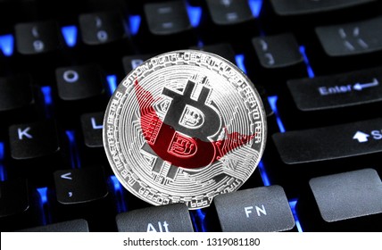 Bitcoin close-up on keyboard background, the flag of Easter Island Rapa Nui is shown on bitcoin.