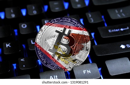 Bitcoin close-up on keyboard background, the flag of American Samoa is shown on bitcoin.