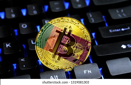 Bitcoin close-up on keyboard background, the flag of Sri Lanka is shown on bitcoin.
