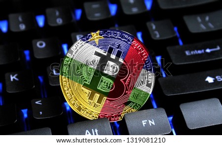 Bitcoin close-up on keyboard background, the flag of Central African republic is shown on bitcoin.
