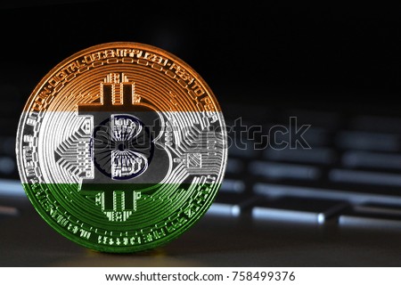 Bitcoin close-up on keyboard background, the flag of India is shown on bitcoin.
