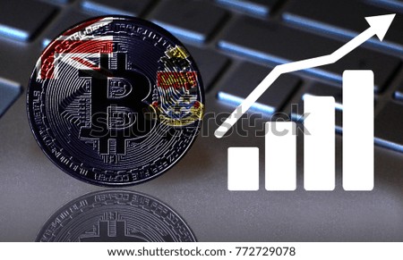 Bitcoin close-up on the keyboard background, the Cayman islands flag is shown on the bitcoin.