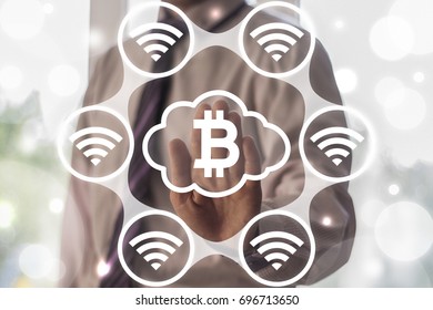 Bitcoin Cloud Computing Blockchain Financial Web Network Technology concept. Man presses cloud bitcoin button on a virtual graphical user interface.