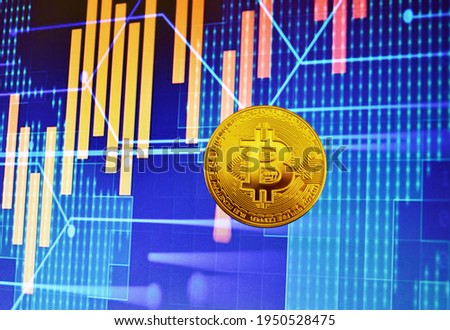 Bitcoin coin on background of cryptocurrency trading exchange chart. BTC mining and investing concept. Blockchain and financial technology. Crypto prices and charts, listed by market capitalization