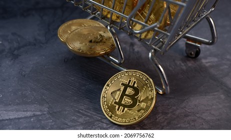 Bitcoin coin and shopping trolley. virtual Money investment concept. Jakarta, 5 November 2021.