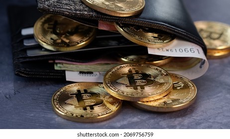 Bitcoin coin with a wallet and money. virtual Money investment concept. Jakarta, 5 November 2021.