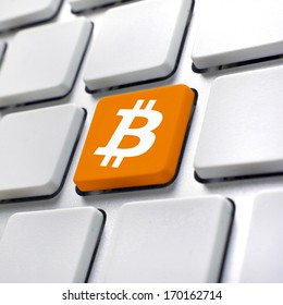 Bitcoin computer key. Bitcoin button, symbol for virtual crypto currency.