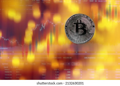 Bitcoin crypto currency on code data numeric digital system cyber symbols and candlestick chart stock market trade. plan investment currency profit business finance for 2022 new year concept.