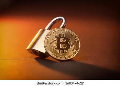 Bitcoin Crypto Currrency Coin And A Padlock, Crypto Shutdown And Fall Due To Coronavirus Global Pandemic Crisis, Stock And Economy Fall Due To Uncertainty And Anxiety, Unstable Situation And Future