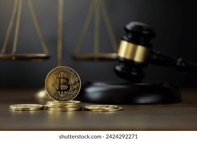 Bitcoin Crypto Regulation And Law. Cryptocurrency laws. Bitcoins and a wooden gavel with a golden scale on the table. Cryptocurrency Legislation and Tax Laws are regulated by the government.