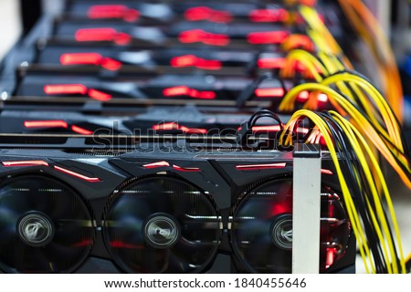 Bitcoin and cryptocurrency miner - a mining computer. Close-up on several GPU