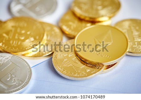 Bitcoin cryptocurrency on the chart background, close-up, shallow depth of field