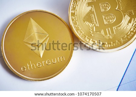 Bitcoin cryptocurrency on the chart background, close-up, shallow depth of field