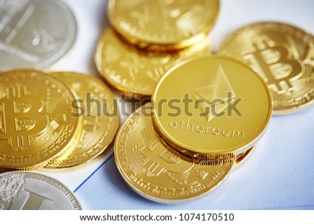 Bitcoin cryptocurrency on the chart background, close-up, shallow depth of field
