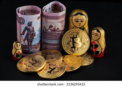 Bitcoin Cryptocurrency and Russian Rubles banknotes with wooden Russian national doll Babushka Matryoshka. BTC Bitcoin Cryptocurrency Russia Ruble Money 