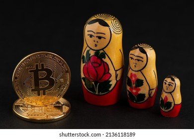 Bitcoin Cryptocurrency with Wooden Russian national doll Babushka Matryoshka.  Bitcoin Cryptocurrency Russia Ruble Exchange money USD Dollar BTC  