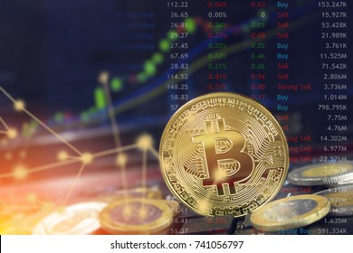 Bitcoin currency with blockchain concept on laptop keyboard with coins and charts and graphs.  Crypto investment security and strategy.