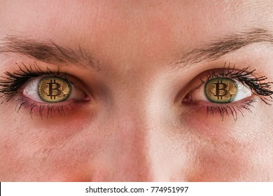Bitcoin. Eyes of a person with the logo bitcoin. The place of the pupils in the human bitcoin