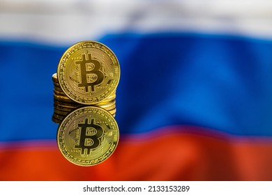 Bitcoin In Front Of Russian Flag. Digital Cryptocurrency. The Russian Flag Background.