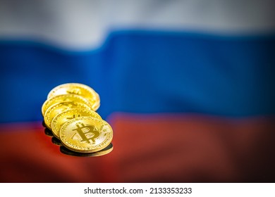 Bitcoin In Front Of Russian Flag. Digital Cryptocurrency. The Russian Flag Background.