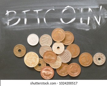 Bitcoin Future In Japan Market With Unclear Direction. The Photo Of Blackboard With The Word Of Bitcoin  And Japanese Yen Coins.