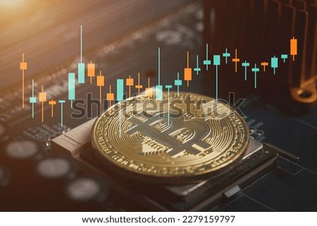 Bitcoin gold coin and defocused chart background.