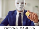 Bitcoin in hand of masked secret man, cryptocurrency scam, financial criminal of digital wallet. Cryptocurrency market fraud, blackmailer financial disaster, fake investment manager, alert platform