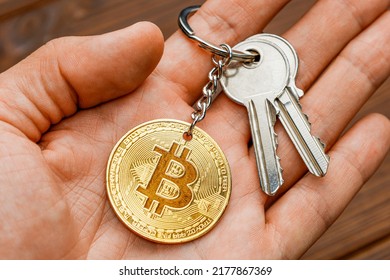 Bitcoin keys in human hand. Cryptocurrency password.