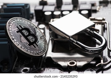 Bitcoin With Locker On Motherboard. Cryptocurrency Law. Digital Security. BTC Banned.