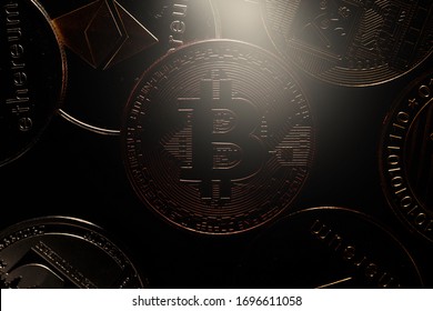 Bitcoin on black background. Photo in the dark key. New currency in the market
