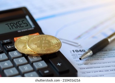 Bitcoin on a calculator and individual income tax return form 1040. tax for the trading of crypto-currencies.The time to pay taxes concept.