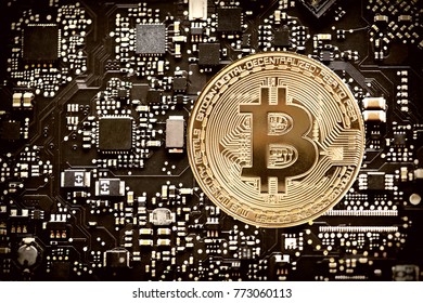 bitcoin on computer chip, closeup