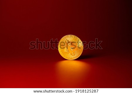 Bitcoin on a red background. Blockchain, token, cryptocurrency. Exchange of currencies. Money. gold coin Stock photo © 