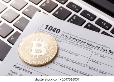 Bitcoin Physical Coin Symbol On Laptop With Tax Form, Future Concept Financial Currency, Crypto Currency Sign