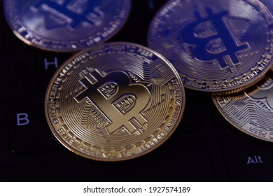 bitcoin is place on the keyboard of the laptop, cryptocurrency trading technology concept.