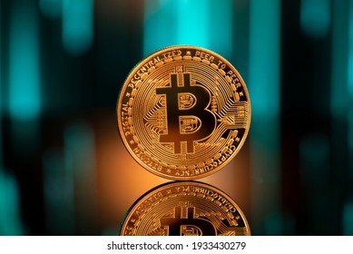 Bitcoin with reflection in front of a blurred blockchain background