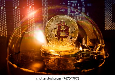 Bitcoin in a soap bubble on video card background. Dangers and risks of investing to bitcoin. Speculation - Shutterstock ID 767047972