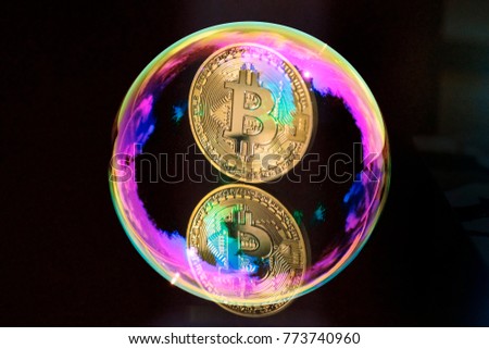 Bitcoin in a soap bubble. Suitable for speculative bubble or market bubble concept.