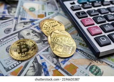 Bitcoin Souvenir Coin And Calculator On The Background Of Dollars. Isolated Bitcoin Gold Coin. New Virtual Money