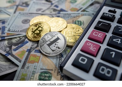 Bitcoin Souvenir Coin And Calculator On The Background Of Dollars. Isolated Bitcoin Gold Coin. New Virtual Money