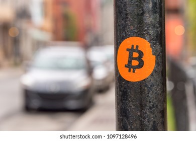 Bitcoin Sticker On A Street Sign Post